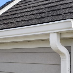 Before and after exterior gutter and downspout cleaning
