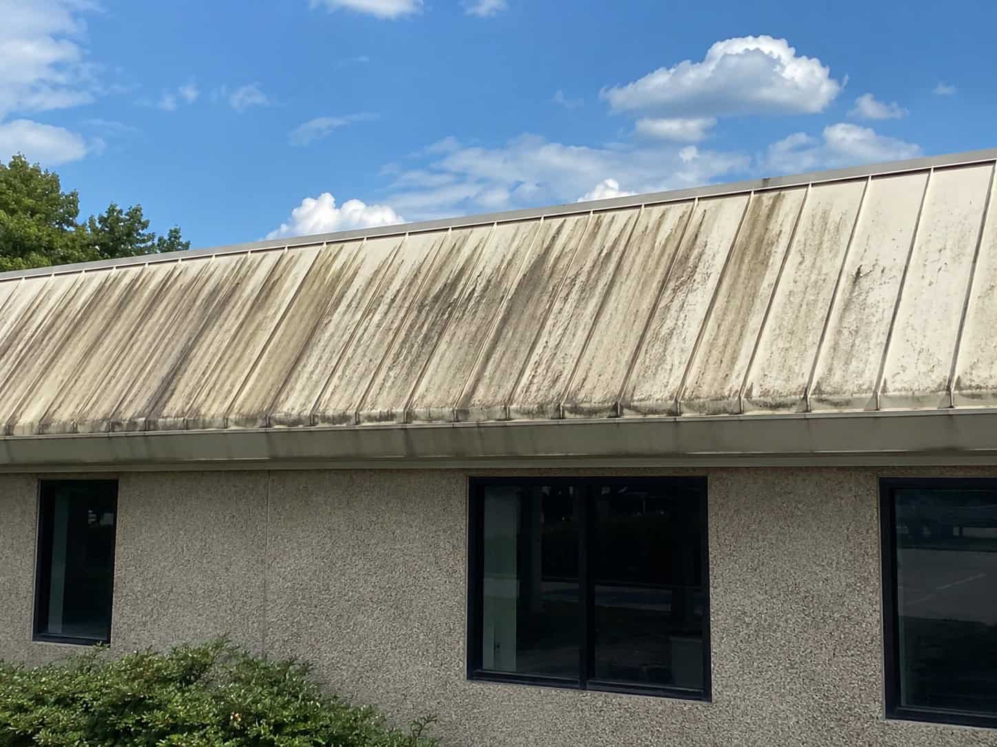 Commercial Roof Cleaning for a stained metal roof in Raleigh